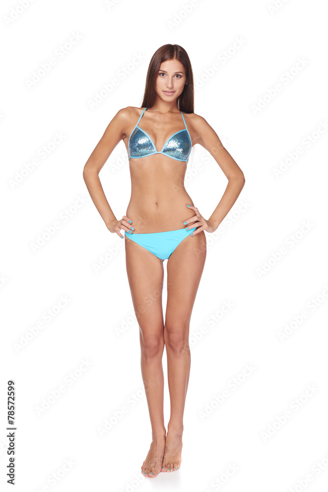 Full length beautiful slim woman in blue bikini