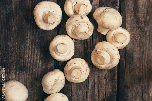 champignon on vintage wood table background - rustic style