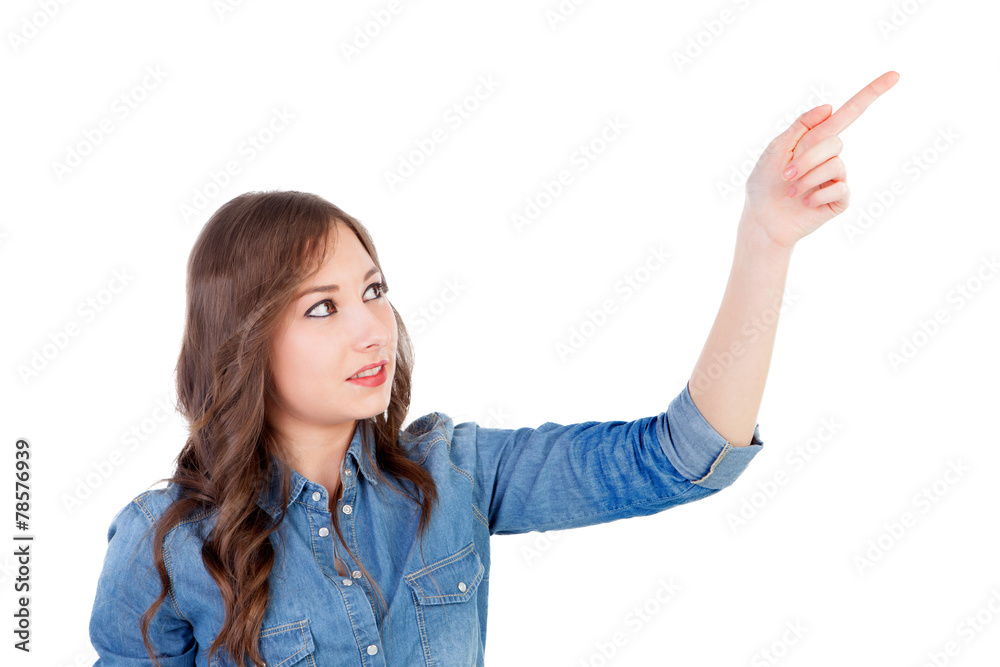 Pretty young woman indicating something with the finger Pretty young woman indicating something with the finger