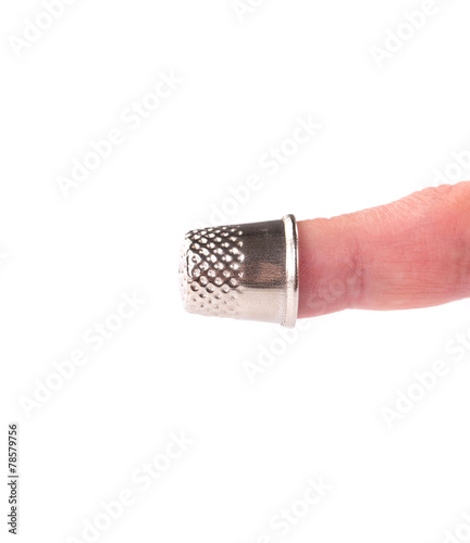 Protective thimble on the woman hand