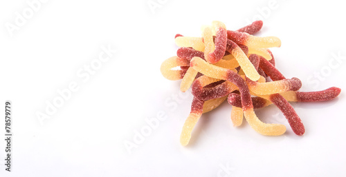 Brown and white sugar jelly candy strip over white background