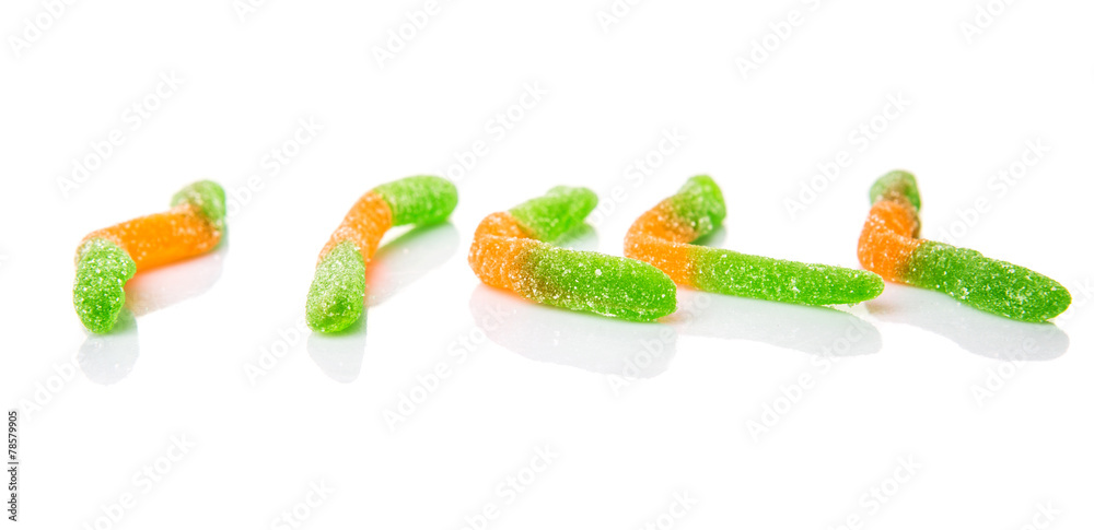 Green and orange sugar jelly candy strip over white background Green and orange sugar jelly candy strip over white background