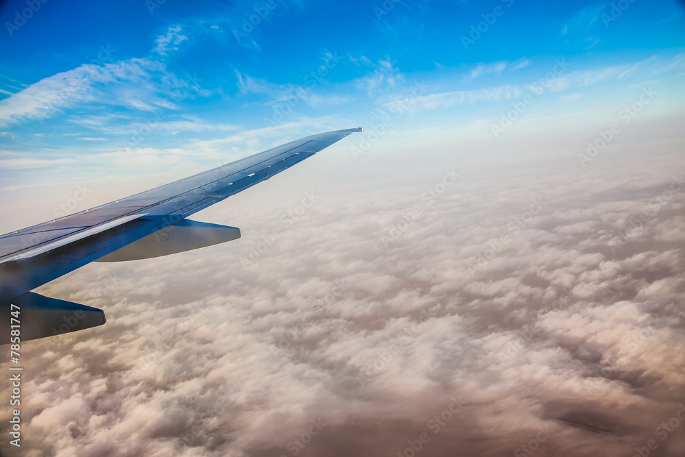 Wing of the plane on blue sky background Wing of the plane on blue sky background