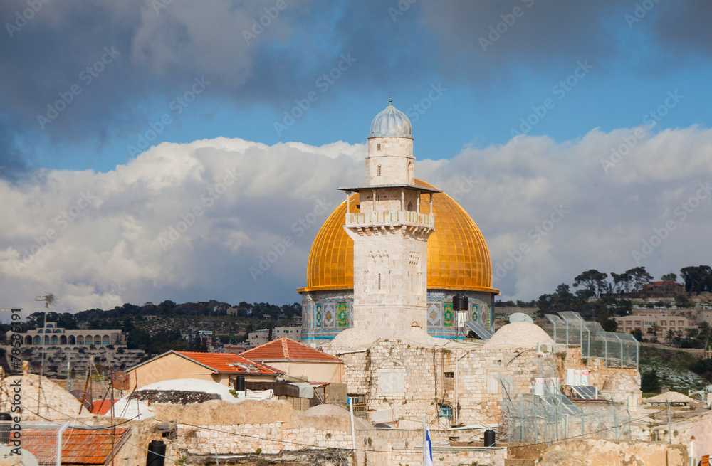 Minaret and Dome of the Rock against cloudy sky
