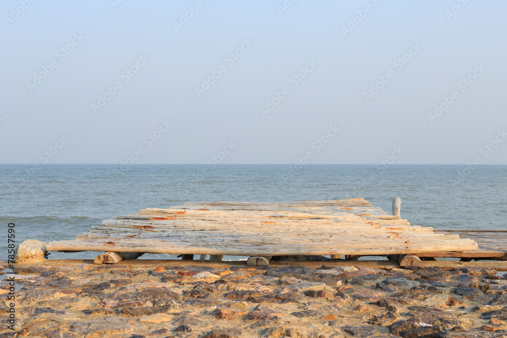 wooden pier to the sea and sky