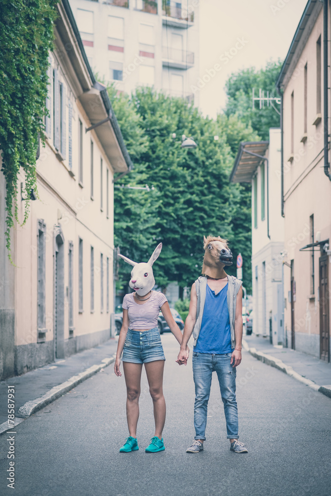 horse and rabbit mask couple of friends young  man and woman
