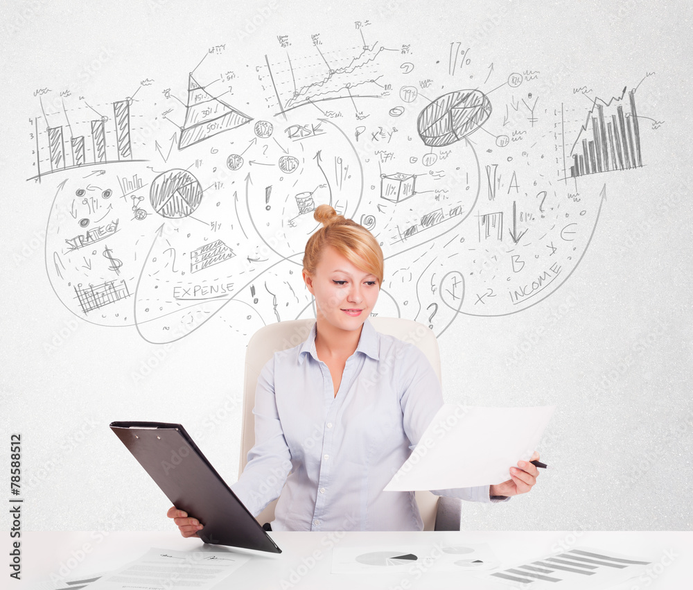 Business woman at desk with hand drawn charts