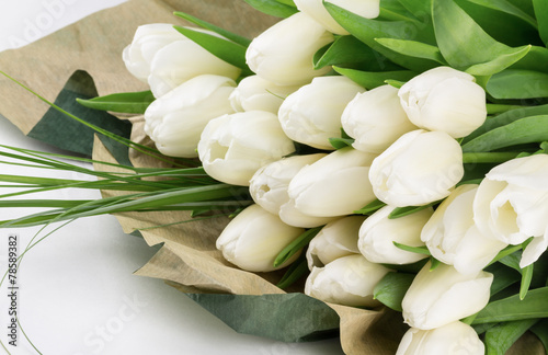 Fototapeta Naklejka Na Ścianę i Meble -  Fresh cut tulip flowers with greens