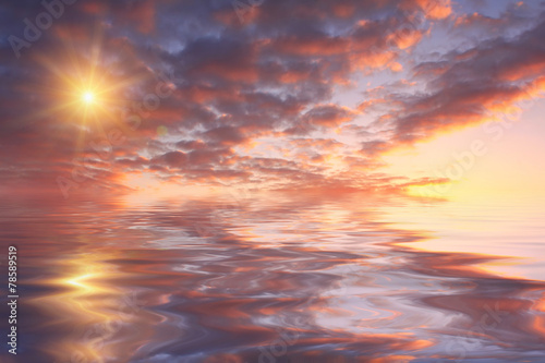Beautiful sunset over sea with reflection in water