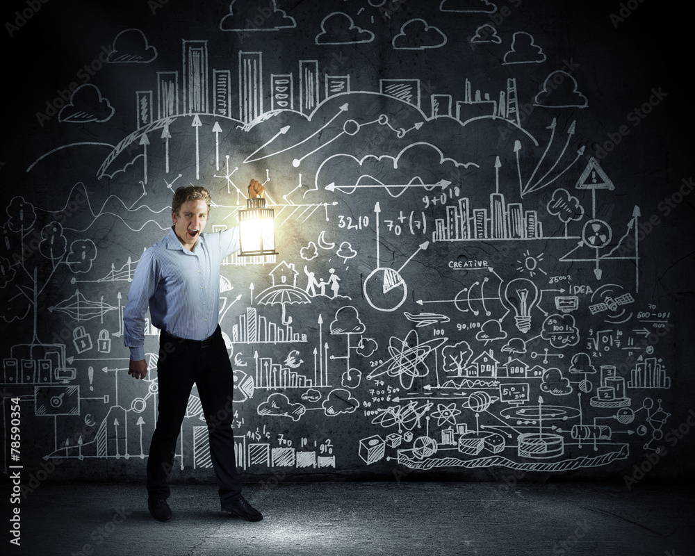 Businessman in search in darkness Businessman in search in darkness