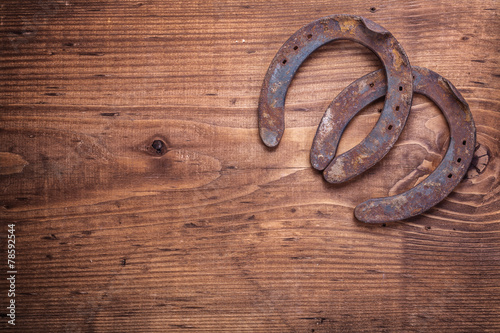 copyspace image two old cast iron metal western horse shoeing ac photo