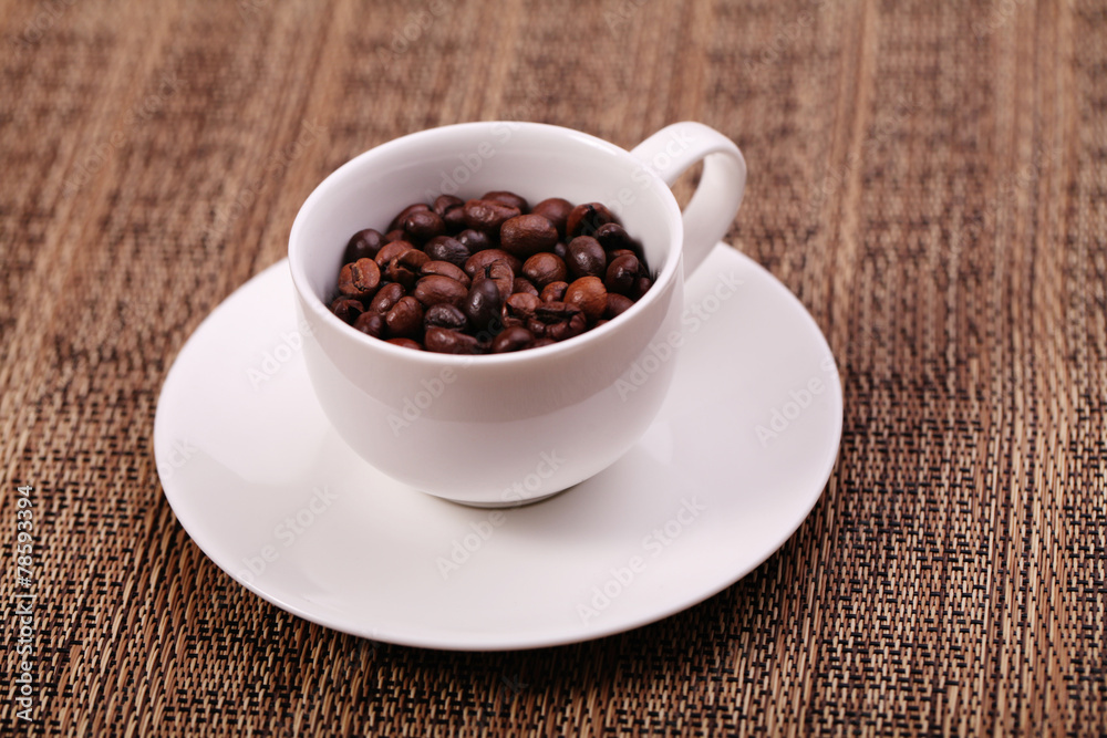 Cup with coffee beans, close up Cup with coffee beans, close up