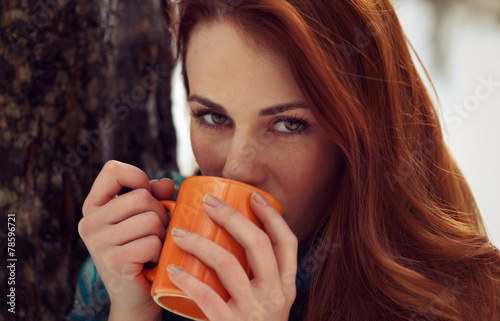 Beautiful woman drinking tea outdoor