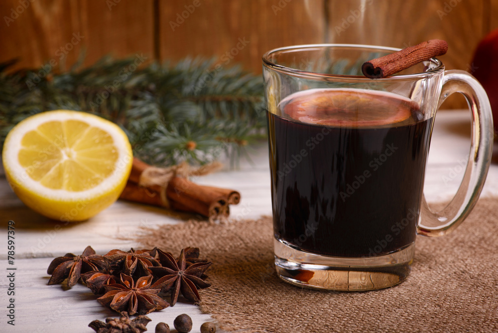 Mulled wine, punch and spices for glintwine on wooden background