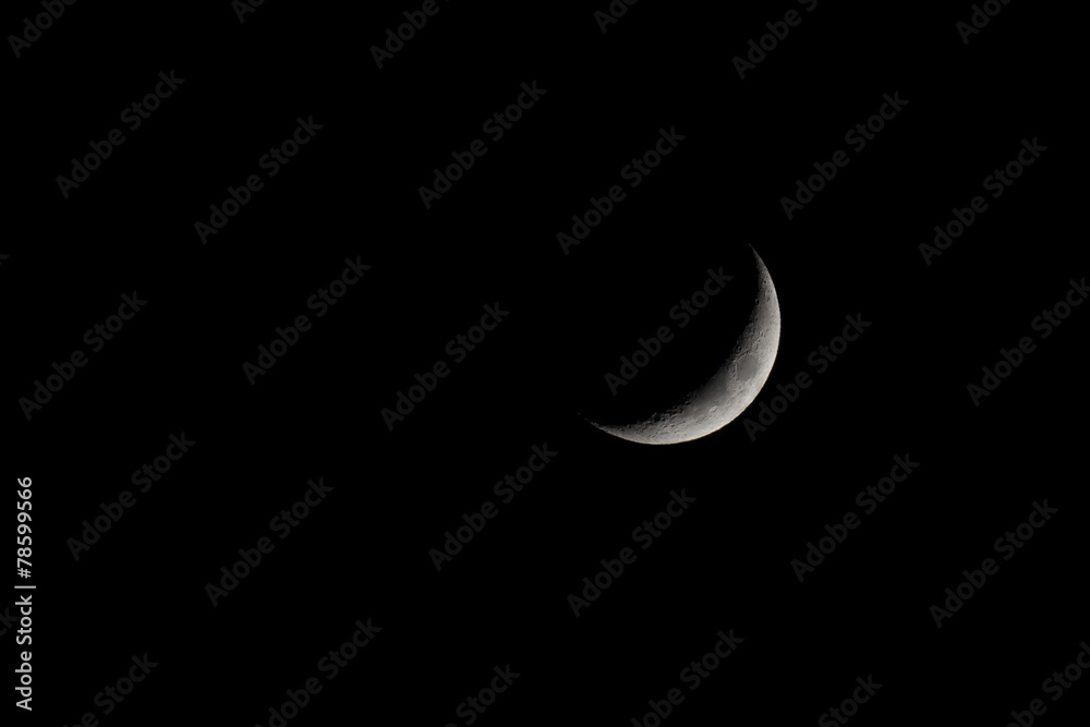 Naklejka premium Waxing Crescent Moon Phase isolated on black