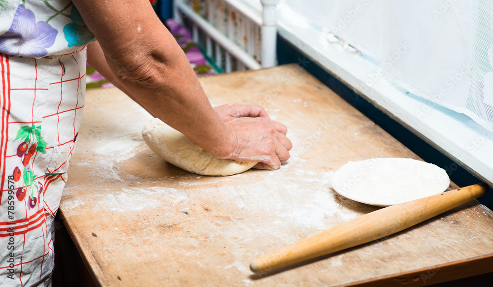 hand with rolling pin and flour hand with rolling pin and flour