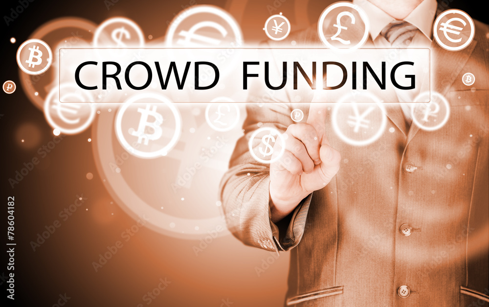 Businessman pushes virtual crowd funding button Businessman pushes virtual crowd funding button
