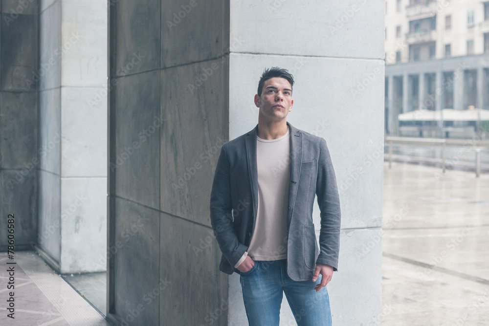 Young handsome man posing in the city streets Young handsome man posing in the city streets