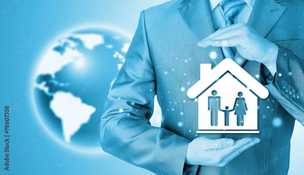 businessman protecting family in home with hands businessman protecting family in home with hands