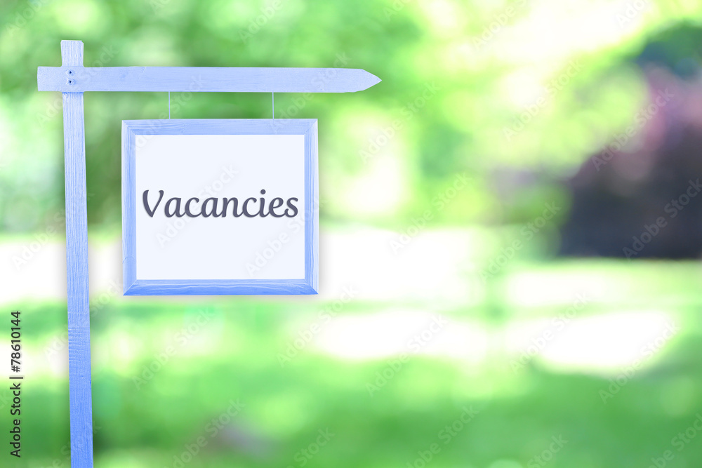 Signboard with text Vacancies near hotel