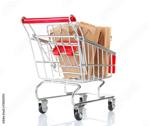 Small shopping cart with paper bags isolated on white