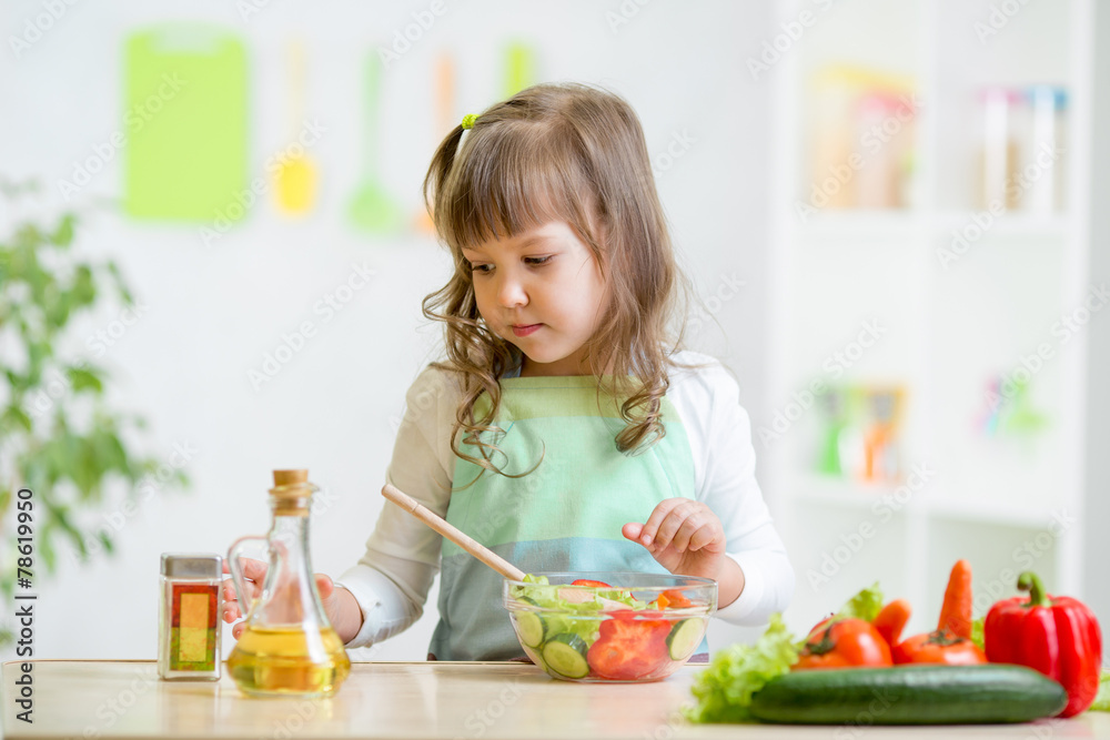 kid girl preparing vegetables