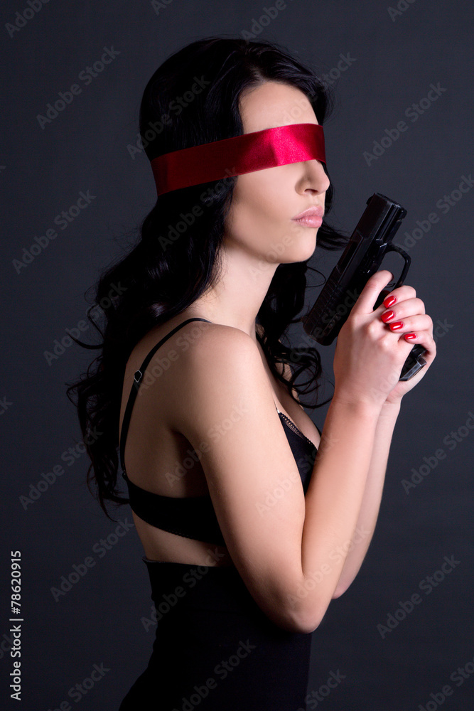 young beautiful sexy woman in black lingerie with red ribbon on young beautiful sexy woman in black lingerie with red ribbon on