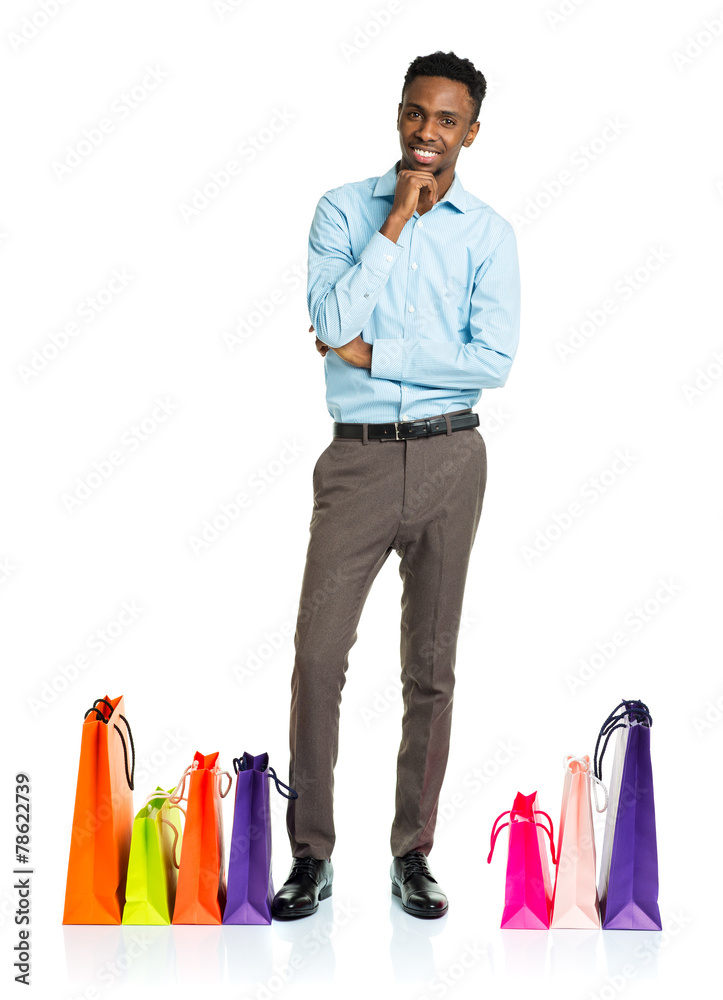 Happy african american man with shopping bags on white backgroun Happy african american man with shopping bags on white backgroun