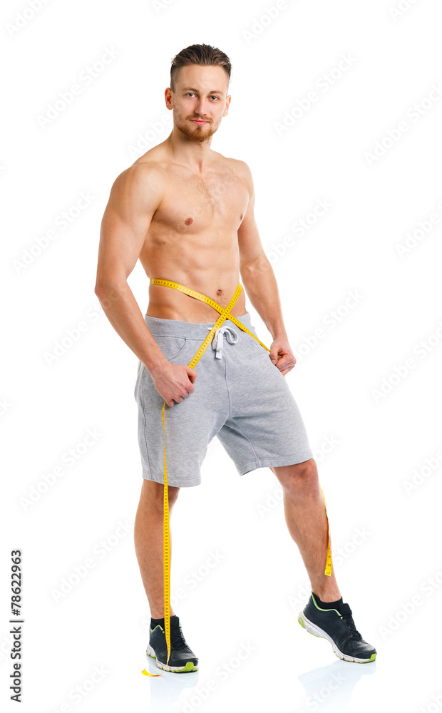 Fototapeta premium Sport man with measuring tape on the white