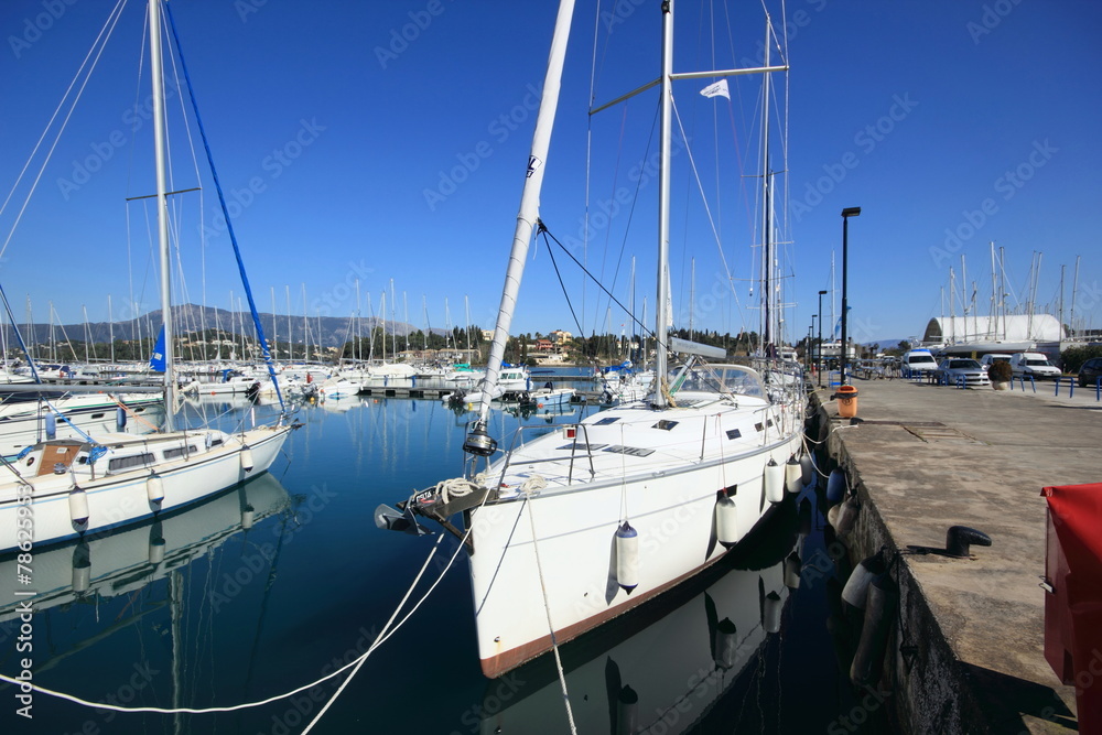Fototapeta premium Yachts and sail boats reflected in a Marina harbour