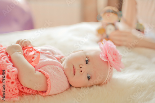 Little baby girl wearing pink knitting dress photo