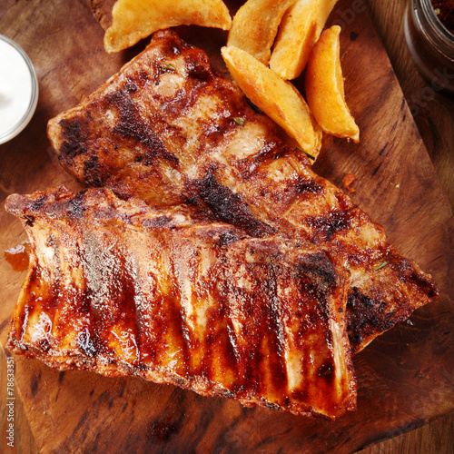 Grilled Pork Rib on Cutting Board with Potatoes