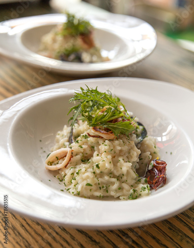 Risotto with seafood served on plate