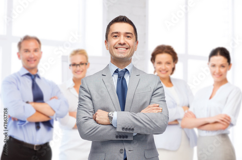 happy smiling business team over office room