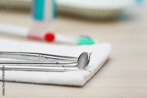 Set dentist tools on napkin on table close up