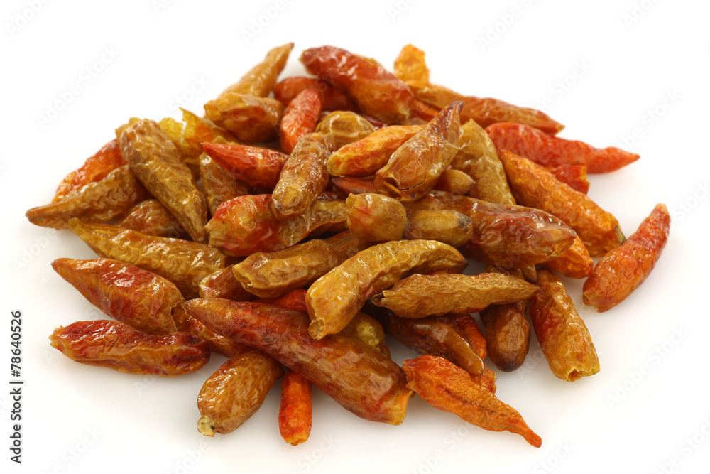 dried red chili peppers (Capsicum) on a white background