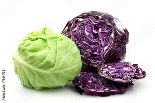 Slika na platnu Freshly cut red and white cabbage on a white background