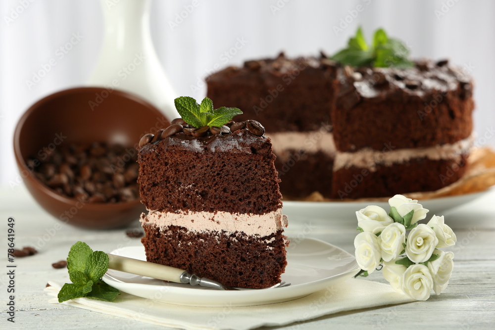 Delicious chocolate cake on table on light background Delicious chocolate cake on table on light background