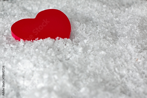 Red heart in the snow