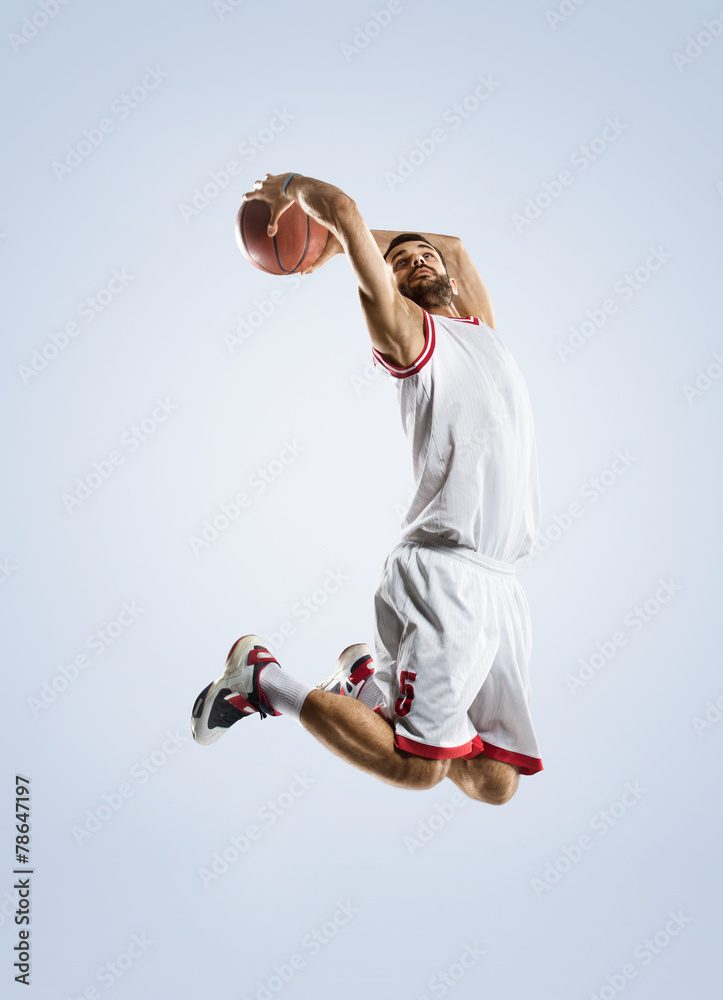 Naklejka premium Basketball player is spinning on his finger