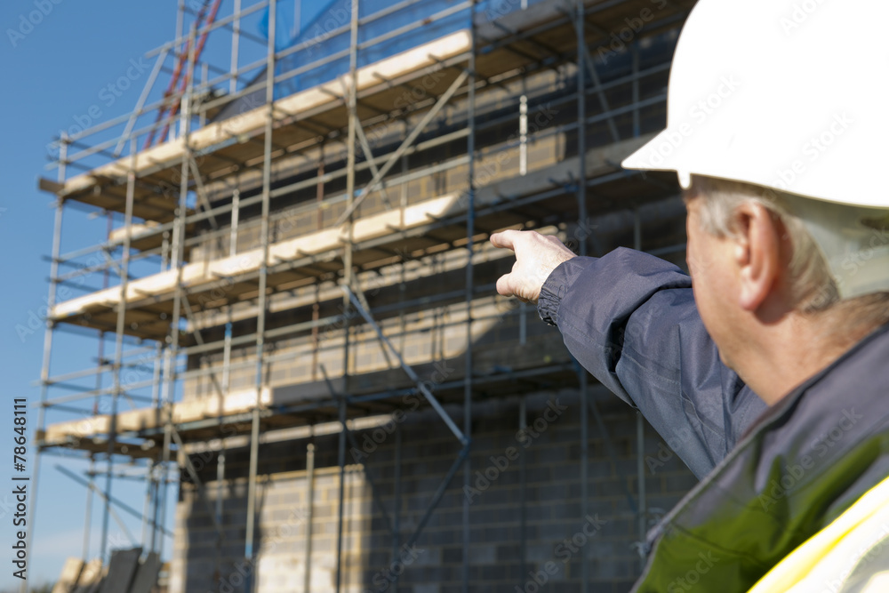 Civil Engineer Pointing Out To Building