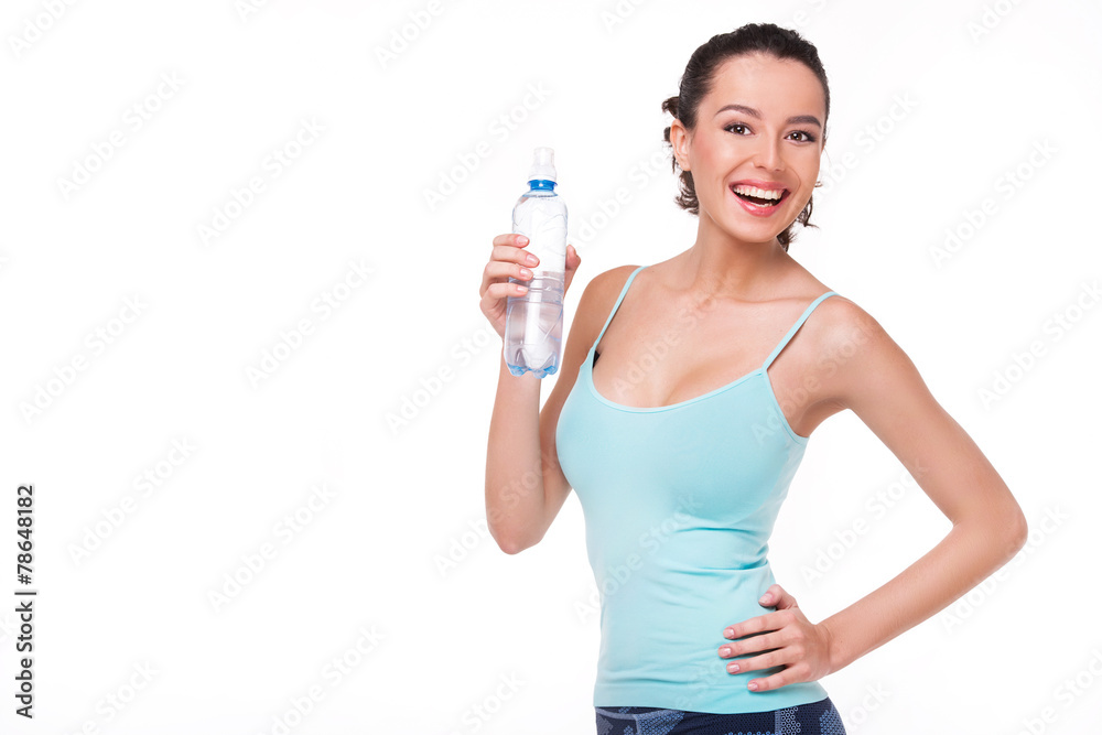 Cheerful sporty woman with a bottle of water Cheerful sporty woman with a bottle of water