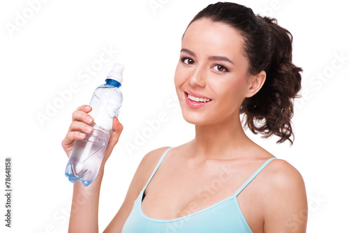 Close up of sporty woman with a bottle