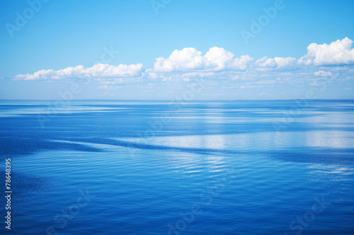 Seascape with blue water and blue sky © evannovostro
