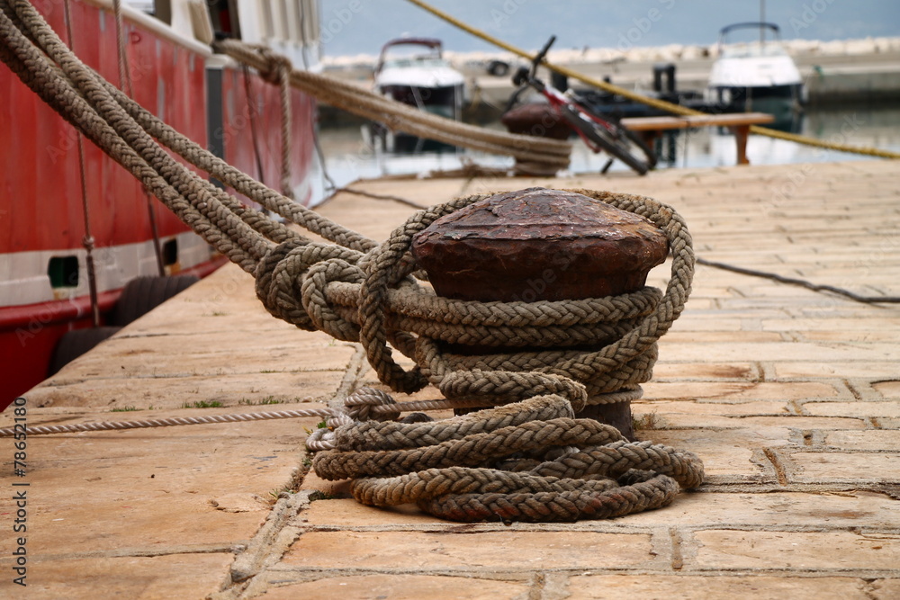 Iron bollard with rope , Croatia