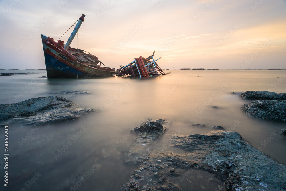 Broken ship with the sunset