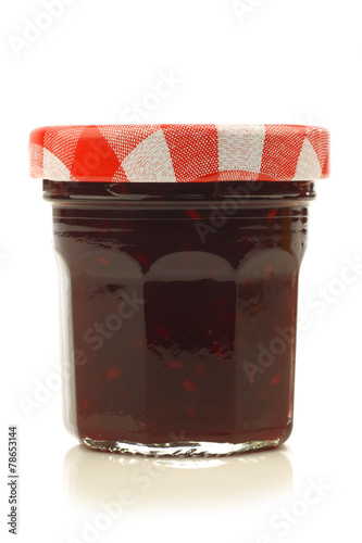 glass jar with fruit jam with room for your label, text or image