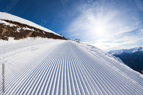 Sunny winter landscape of snow ski-track in Sochi