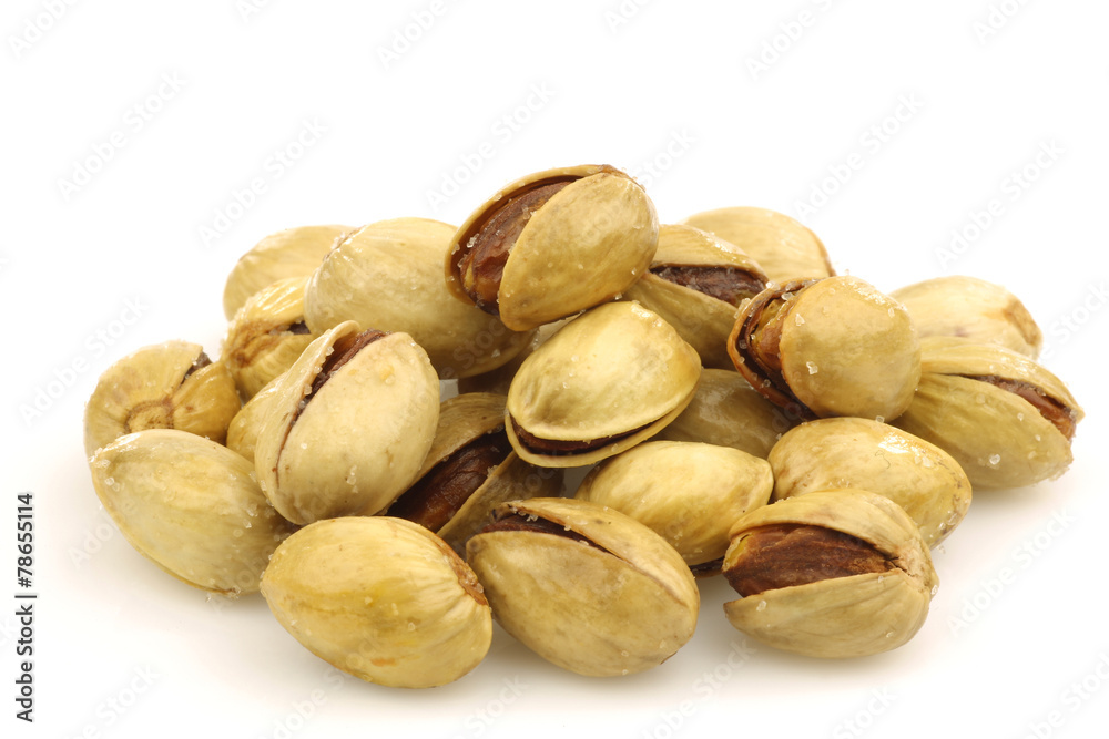 bunch of pistachio nuts on a white background bunch of pistachio nuts on a white background