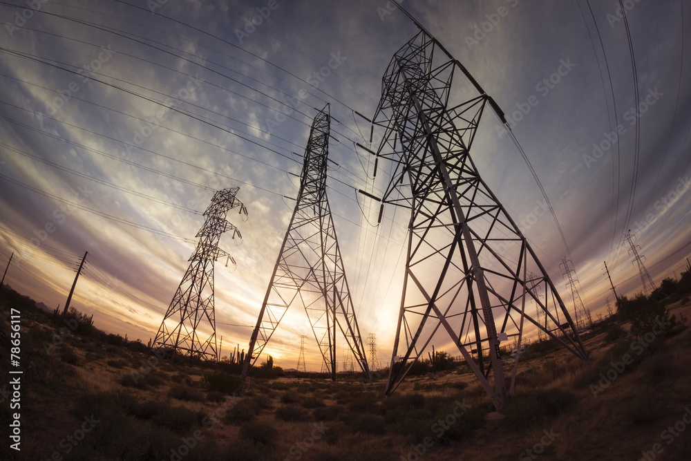 Electricity power pylons at sunset - obrazy, fototapety, plakaty 
